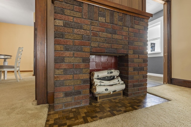 room details with carpet and a fireplace