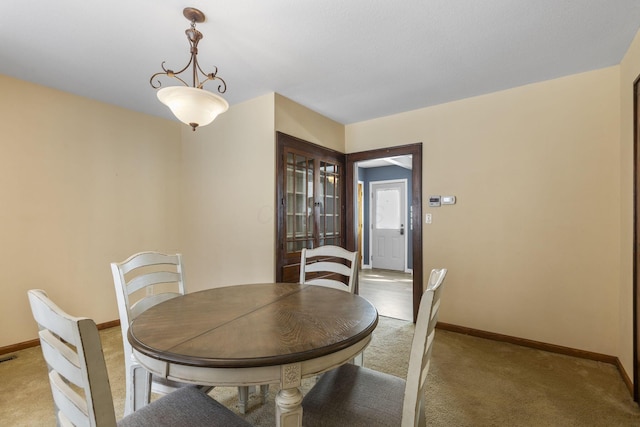 view of carpeted dining area