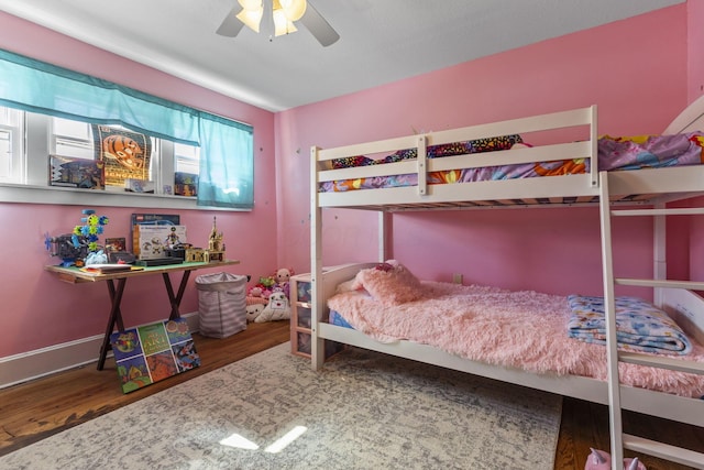 bedroom with ceiling fan and wood-type flooring