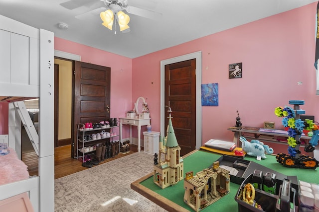 game room featuring hardwood / wood-style floors and ceiling fan