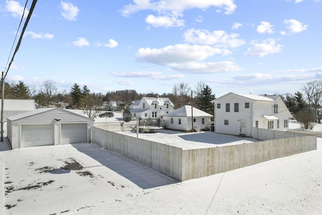 view of yard featuring an outdoor structure and a garage