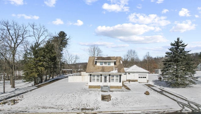 view of snow covered house