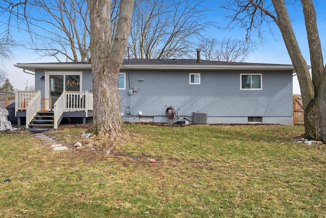 back of house featuring a yard, fence, a wooden deck, and central air condition unit