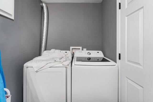 laundry area featuring laundry area and washer and dryer