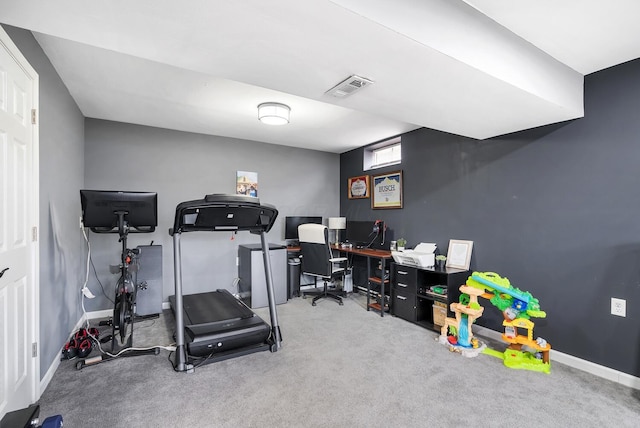 exercise area featuring carpet flooring, visible vents, and baseboards