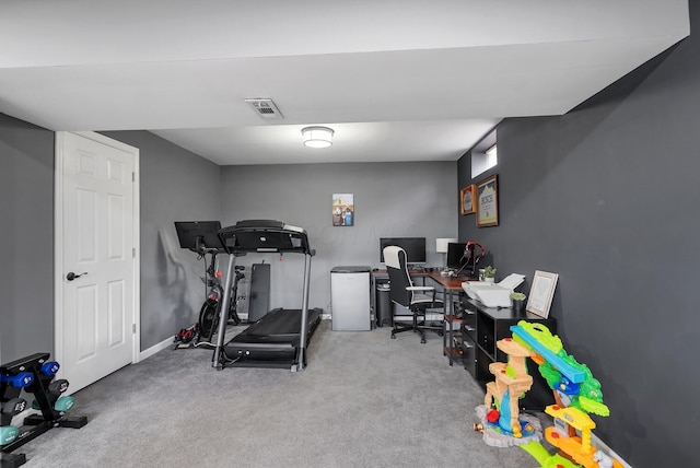 carpeted home office featuring baseboards and visible vents