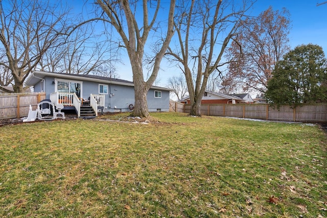 view of yard with a fenced backyard and a wooden deck