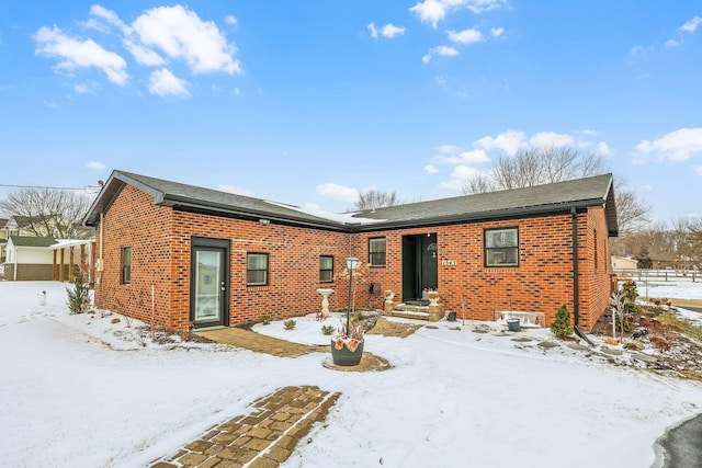 view of front of property featuring brick siding