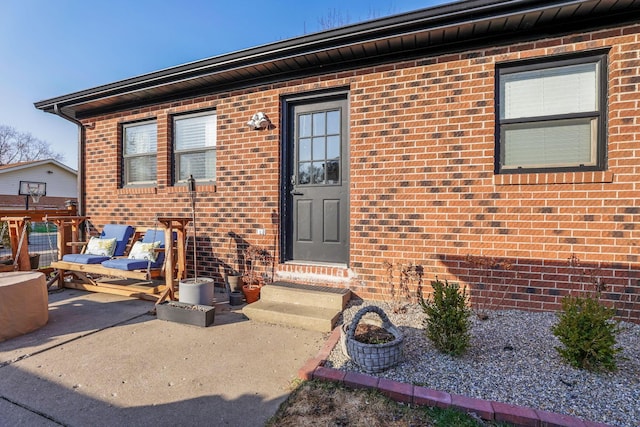 1545 E Choctaw Dr, London, OH 43140 - property entrance featuring a patio area and brick siding