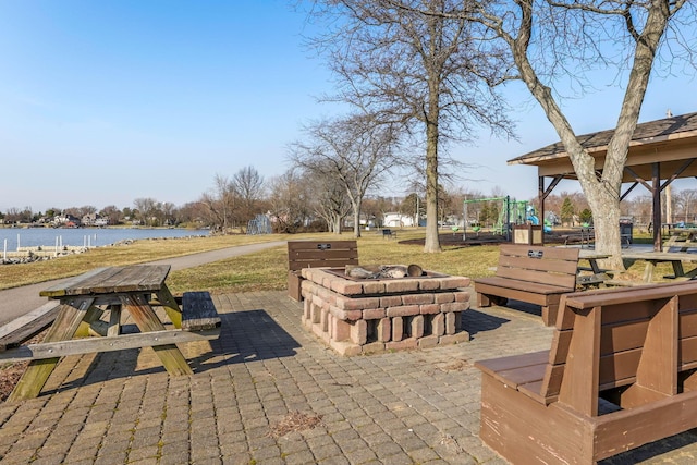 1545 E Choctaw Dr, London, OH 43140 - view of patio / terrace featuring a fire pit and a water view