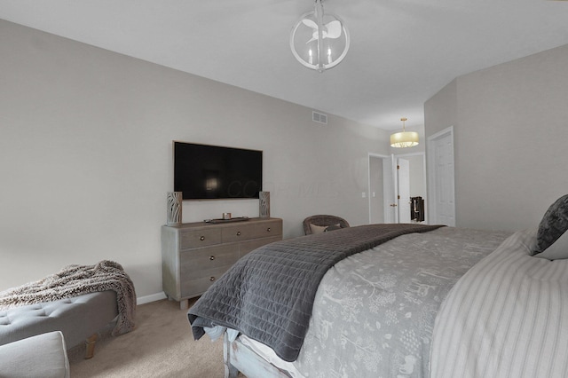 bedroom featuring light colored carpet, visible vents, and a notable chandelier