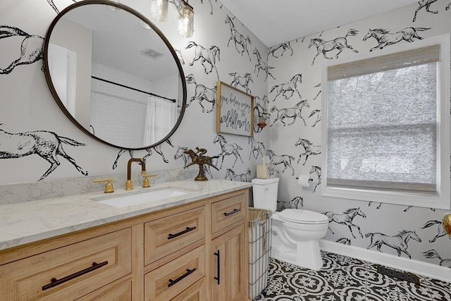 full bathroom featuring visible vents, vanity, toilet, and tile patterned floors