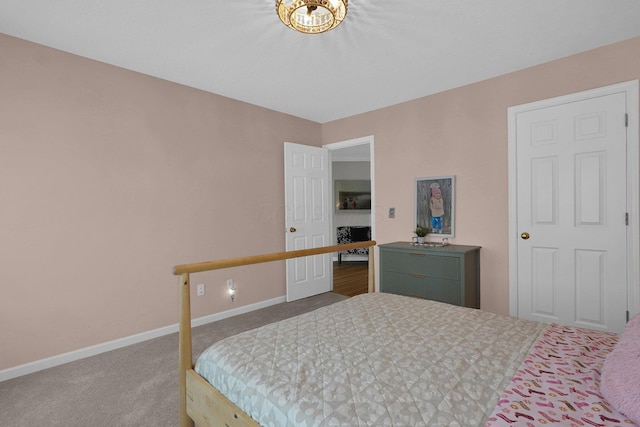 carpeted bedroom featuring baseboards