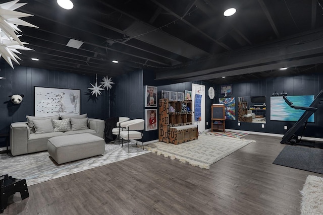 living area with wood finished floors and baseboards