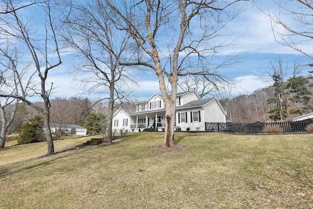 view of front facade featuring fence, a porch, and a front yard