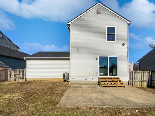 back of property featuring entry steps, a patio area, and fence