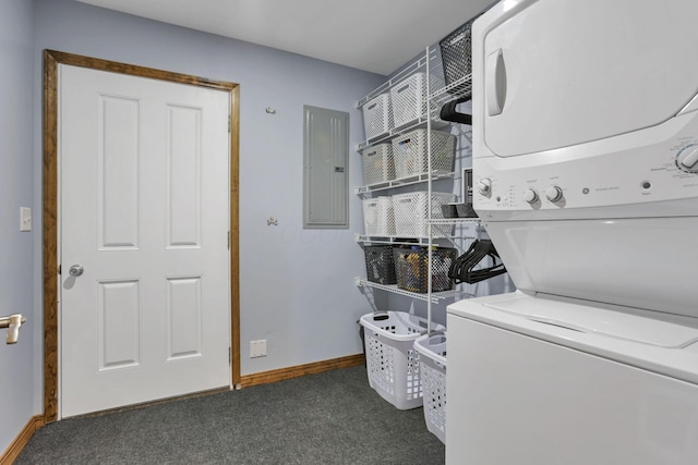 laundry area featuring laundry area, electric panel, baseboards, stacked washer / drying machine, and carpet