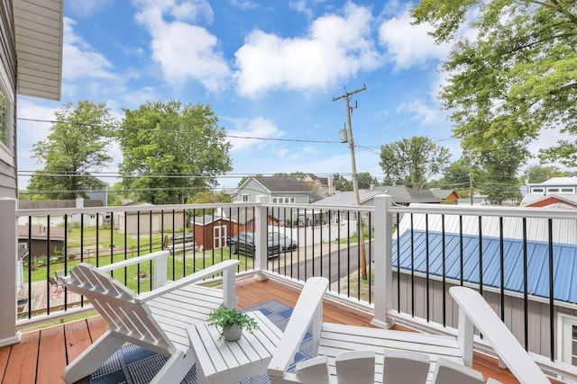 wooden deck featuring a residential view