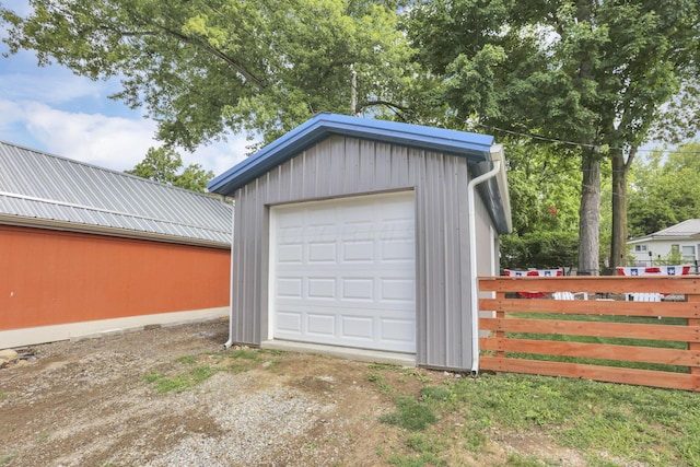 garage with fence