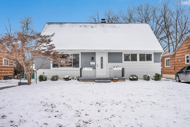 view of front of house with stone siding and covered porch