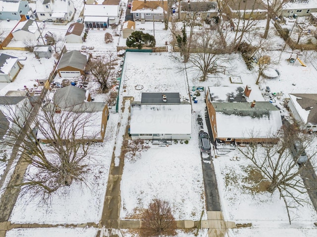 snowy aerial view featuring a residential view