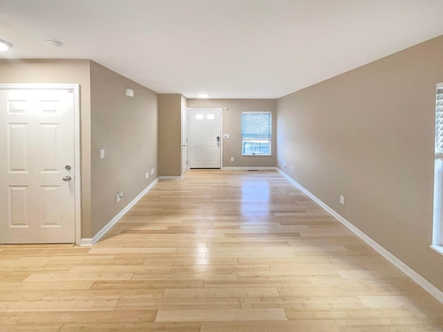 foyer entrance with light hardwood / wood-style flooring