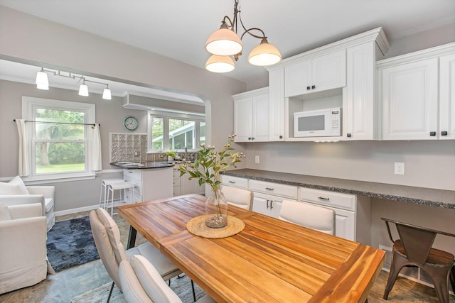 dining space featuring baseboards