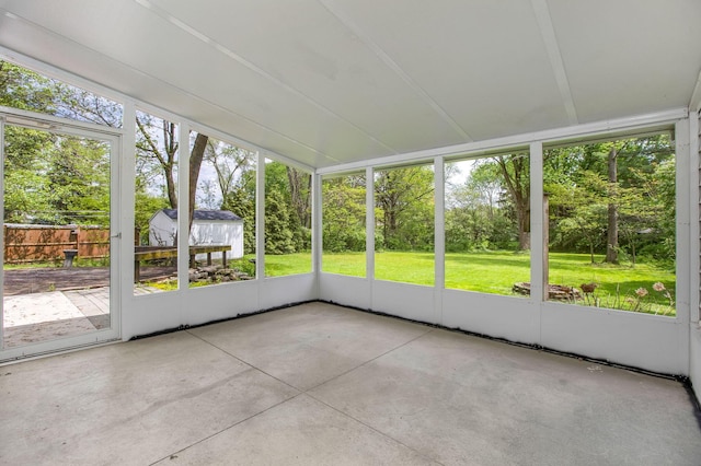unfurnished sunroom with view of scattered trees