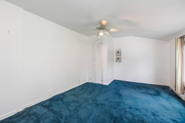 spare room with ceiling fan, carpet floors, and baseboards