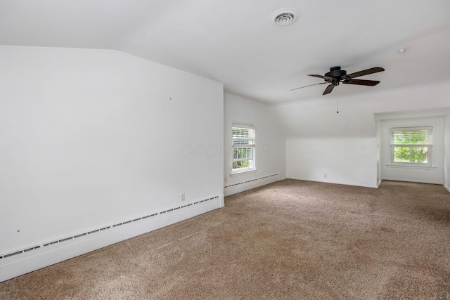 bonus room featuring baseboard heating, lofted ceiling, carpet, and healthy amount of natural light