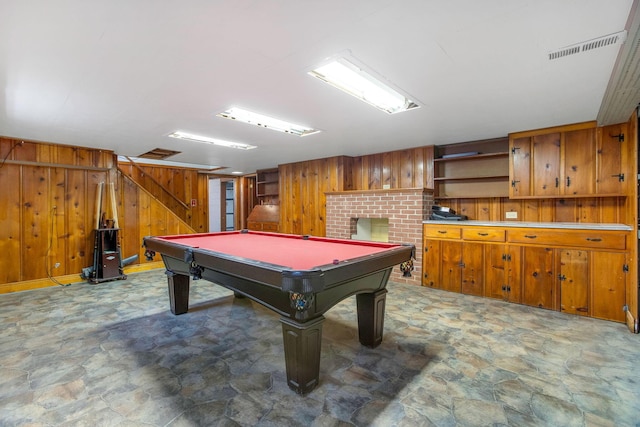 recreation room featuring wooden walls, stone finish floors, and billiards table