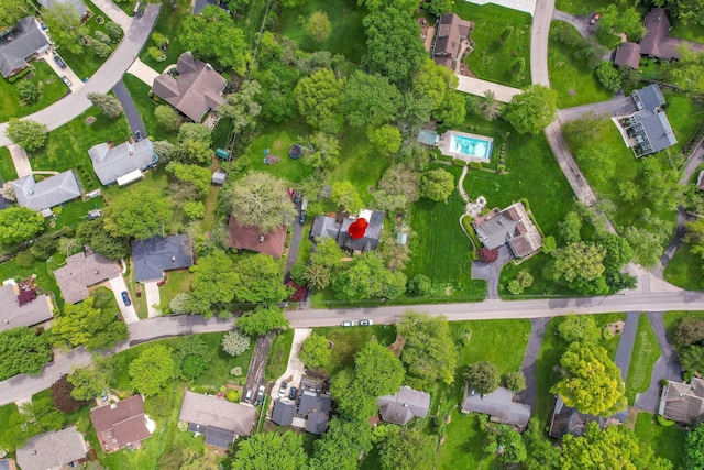 aerial view of property and surrounding area with nearby suburban area