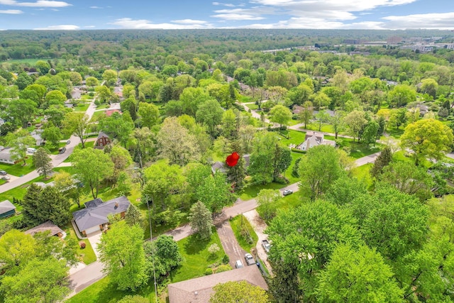 aerial perspective of suburban area with a forest