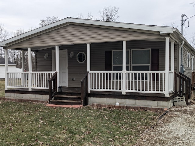 view of front of house with a porch and a front lawn