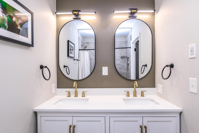 bathroom featuring vanity and a shower with shower curtain