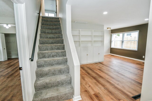 189 N Gould Rd, Bexley, OH 43209 - stairs featuring wood finished floors, baseboards, and recessed lighting