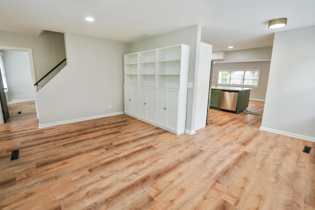 189 N Gould Rd, Bexley, OH 43209 - unfurnished living room with light wood-style flooring, stairway, baseboards, and recessed lighting
