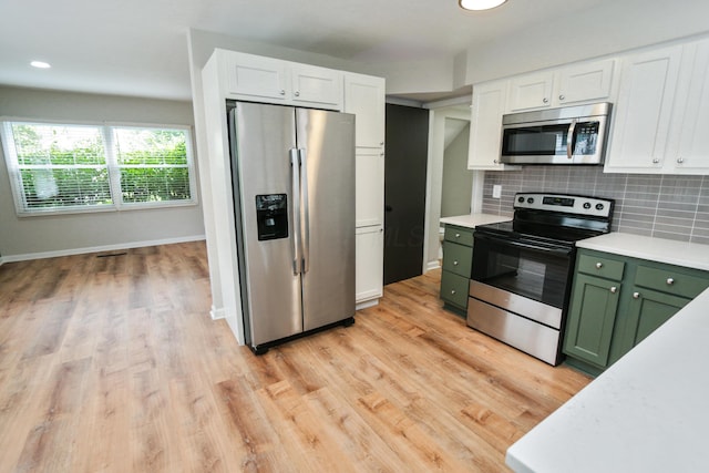 189 N Gould Rd, Bexley, OH 43209 - kitchen featuring appliances with stainless steel finishes, green cabinets, light countertops, white cabinets, and recessed lighting