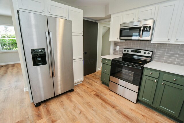189 N Gould Rd, Bexley, OH 43209 - kitchen featuring green cabinets, stainless steel appliances, white cabinets, and light wood-style floors