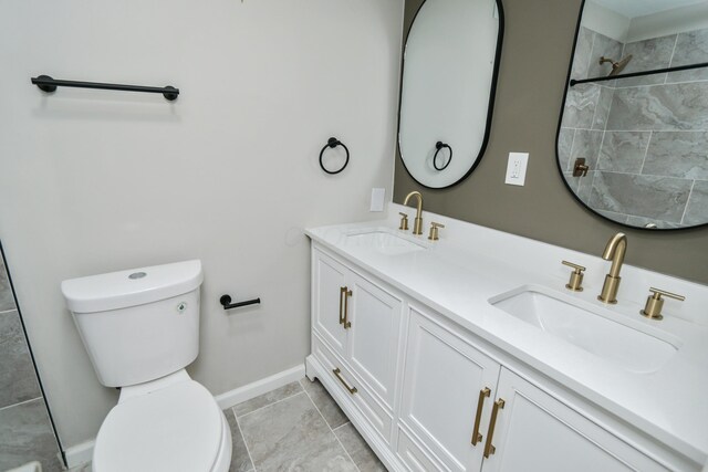 189 N Gould Rd, Bexley, OH 43209 - bathroom with toilet, baseboards, double vanity, and a tile shower