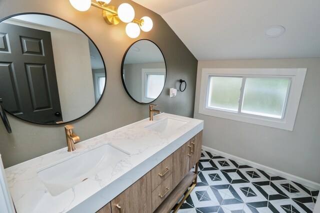 189 N Gould Rd, Bexley, OH 43209 - full bath with vaulted ceiling, double vanity, and baseboards
