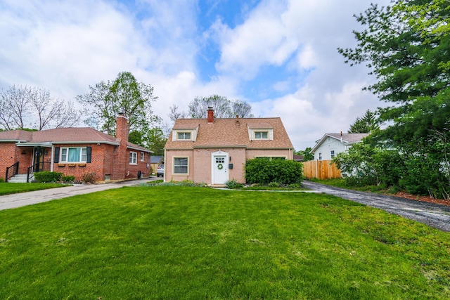 189 N Gould Rd, Bexley, OH 43209 - view of front of house with asphalt driveway, a chimney, brick siding, and a garage
