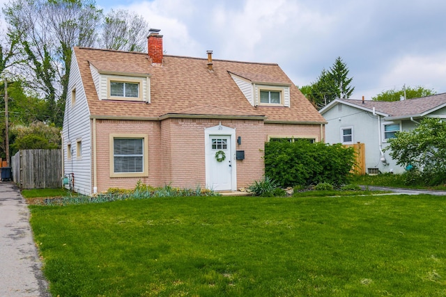 189 N Gould Rd, Bexley, OH 43209 - view of front of house with a chimney, roof with shingles, and brick siding
