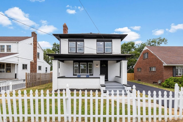 view of front of home featuring covered porch and a front yard