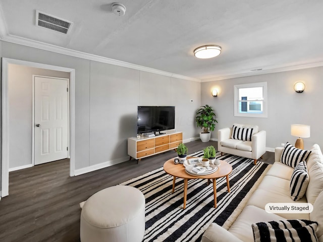 living room featuring ornamental molding and dark hardwood / wood-style floors