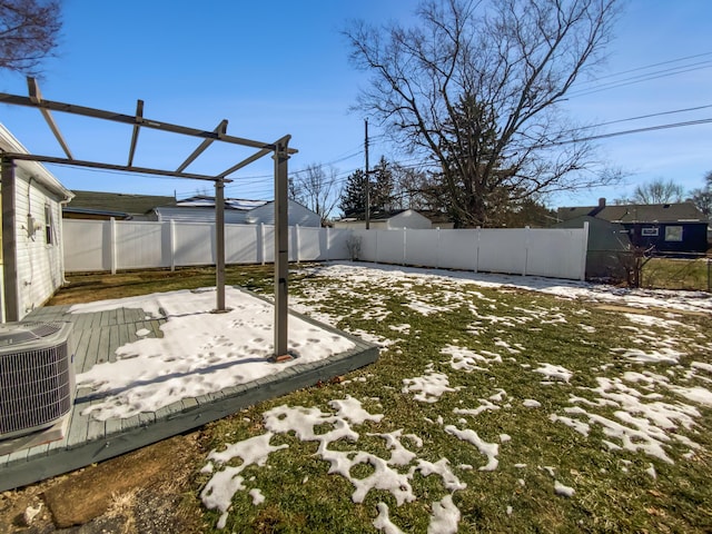 view of yard featuring a pergola and central AC