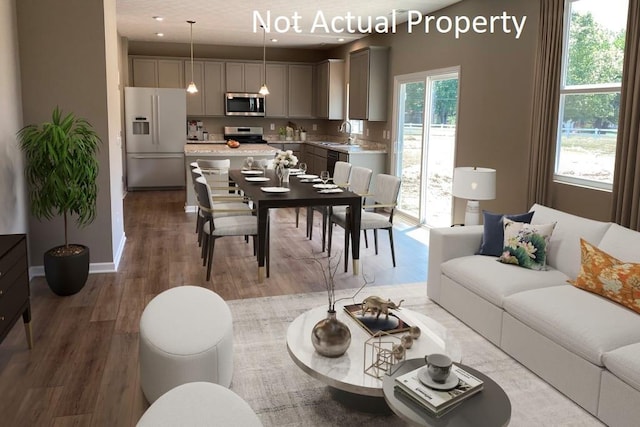 living room with light wood-type flooring and baseboards