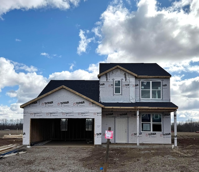 property under construction featuring a garage and driveway