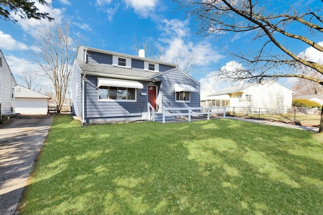 view of front of house with a garage, fence, a chimney, and a front lawn