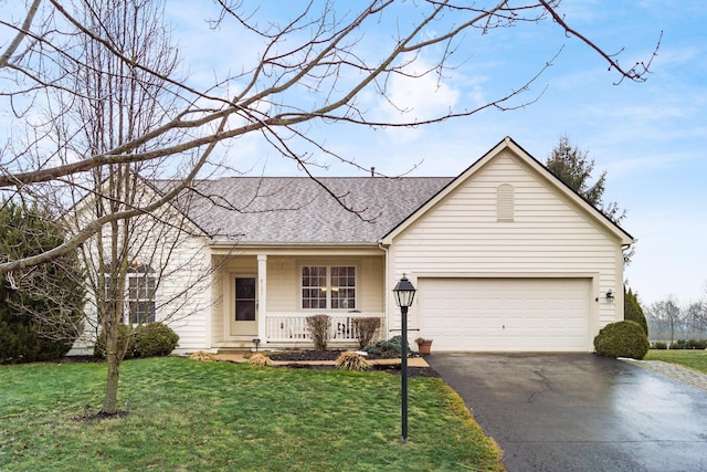 single story home featuring driveway, roof with shingles, an attached garage, covered porch, and a front lawn